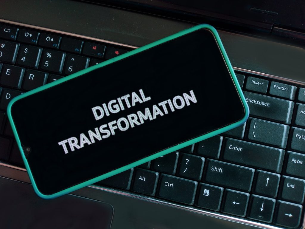 Digital Transformation concept - Laptop computer keys and Smartphone